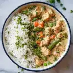 Fluff the coconut rice with a fork and divide it onto four plates Recipe