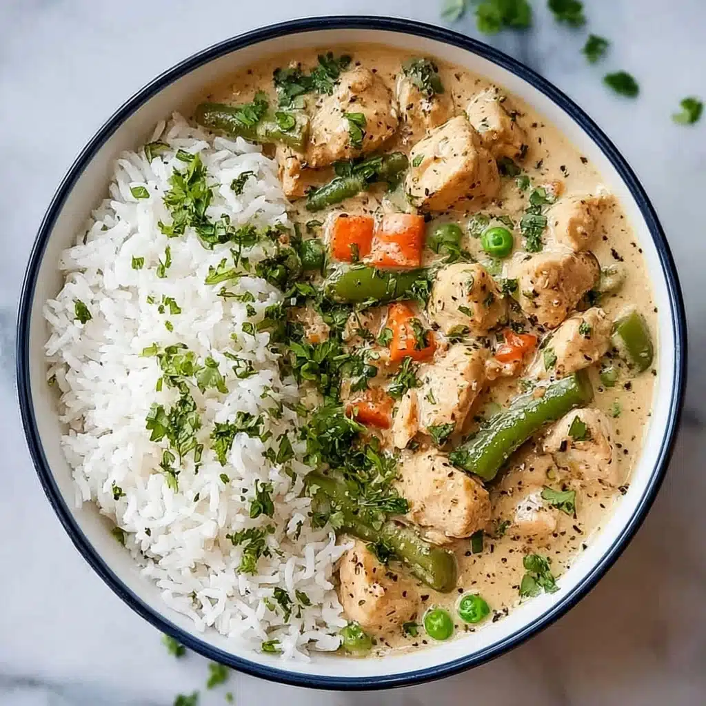 Fluff the coconut rice with a fork and divide it onto four plates Recipe - Recipe Image
