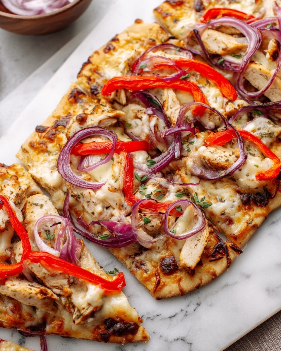 A flatbread with a golden-brown crispy crust is topped with a layer of melted cheese spread unevenly. On top of the cheese are grilled chicken slices with a light brown char and soft texture. Bright red, thin strips of roasted bell pepper are placed in a scattered way over the chicken, along with rings of fresh purple onion that add a pop of color and raw texture. The flatbread is served on a white marble surface, with a blurred white bowl containing more onion slices in the background. Photo taken with an iphone --ar 4:5 --v 7