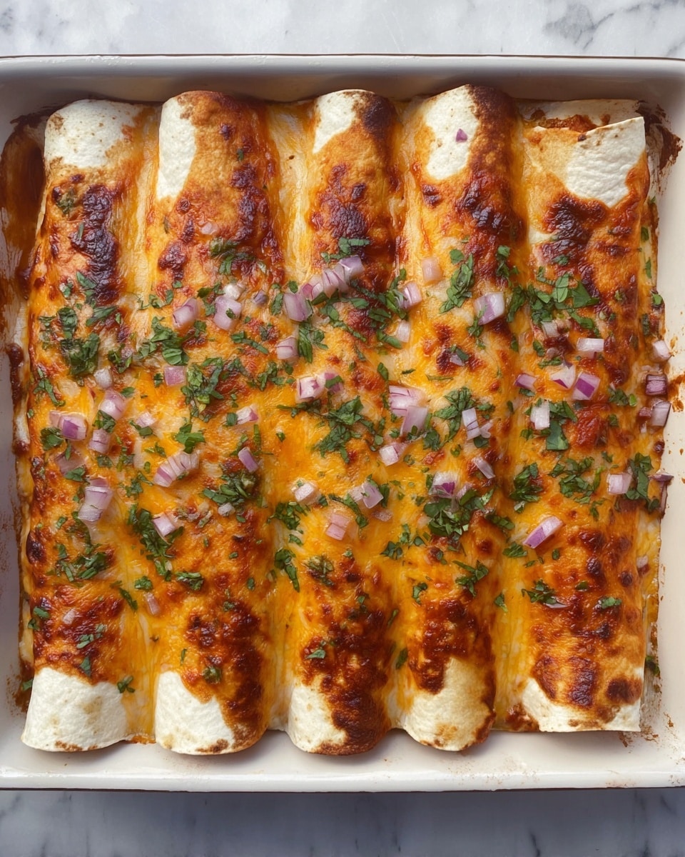 The image shows six rolled tortillas lined up side by side in a rectangular white dish, each covered with a melted layer of orange cheese that looks slightly browned and bubbly. Small pieces of chopped red onion and green herbs are sprinkled evenly on top, adding a fresh contrast to the warm cheesy surface. The edges of the tortillas are lightly browned and slightly curled with some spots showing a bit of baked sauce underneath. The dish sits on a white marbled texture, enhancing the colors of the food. photo taken with an iphone --ar 4:5 --v 7