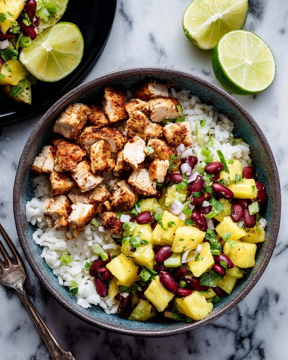 A bowl filled with three distinct layers arranged side by side: on one side, small white grains of cooked rice with a soft texture; next to it, diced grilled chicken pieces with a light brown crispy edge and juicy white inside; and the third section has a colorful mix of yellow pineapple chunks, dark red beans, and green onion slices, all garnished with green cilantro leaves. The bowl is on a white marbled surface, with another bowl of the pineapple bean mix in the top left corner and a white plate with lime wedges in the top right. A silver fork lies on the left side. Photo taken with an iphone --ar 4:5 --v 7