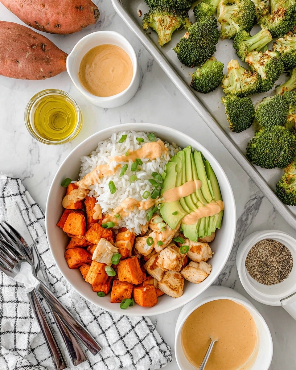 A white bowl contains four neat sections of food: a base layer of plain white rice fills half the bowl, topped with small green onion pieces; next to the rice are golden-brown chicken chunks with a light brown sauce drizzled lightly over them; beside the chicken are bright orange cubes of roasted sweet potato with the same sauce drizzled in spots; the last section has dark green roasted broccoli topped with a few sauce streaks; on top of the broccoli sits thin slices of fresh, light green avocado arranged in a fan shape. Around the bowl are a white baking tray with roasted broccoli, two whole sweet potatoes, a white cup filled with light brown sauce, a glass container of olive oil, a whole avocado cut in half, and a folded white kitchen cloth with black grid lines holding three silver forks. The scene is set on a white marbled surface. Photo taken with an iphone --ar 4:5 --v 7