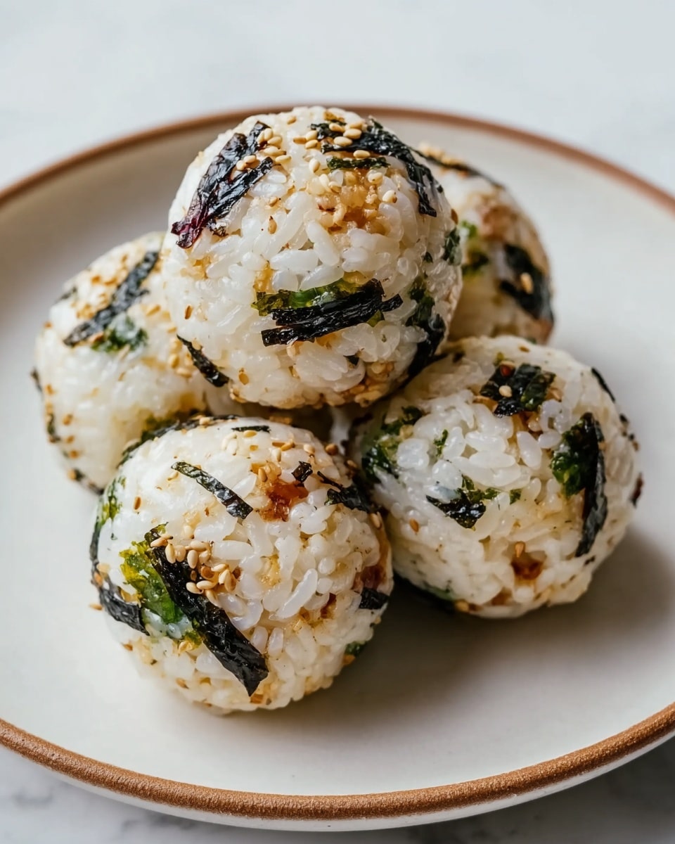 The image shows three golden brown baked pastries on a white plate, each with a bubbly, melted cheese layer on top that has browned spots and is sprinkled with small green herbs. The pastries are rectangular with slightly puffy edges, and underneath the cheese, there are hints of a red tomato sauce peeking out from the sides. The plate is set on a white marbled surface. Photo taken with an iphone --ar 4:5 --v 7